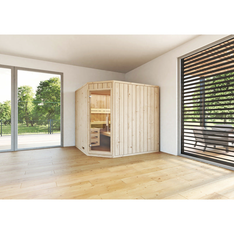 Freestanding Leyla corner sauna made of solid wood with glass door - light-flooded room situation with a view of the countryside