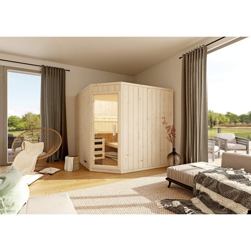 Leyla 5-corner sauna from FinA Wellness in an elegant corner of the room - perfect integration into a quiet living environment with a view of the outdoors